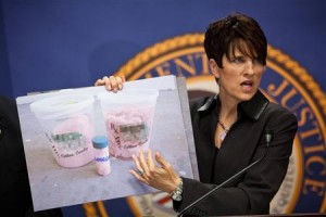 United States Attorney Laura Duffy displays a photo of marijuana cotton candy while announcing law enforcement action against California's marijuana industry in Sacramento.